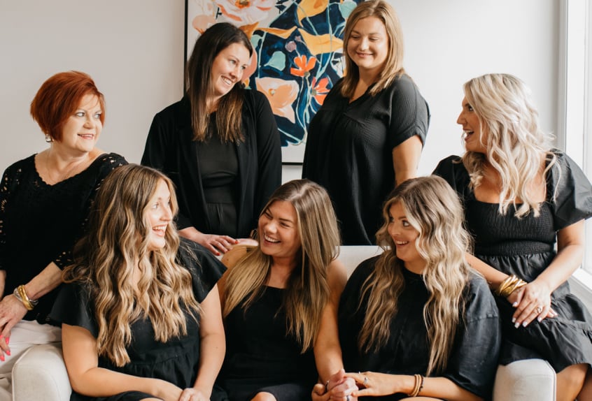 Roots Salon  team laughing together in the studio